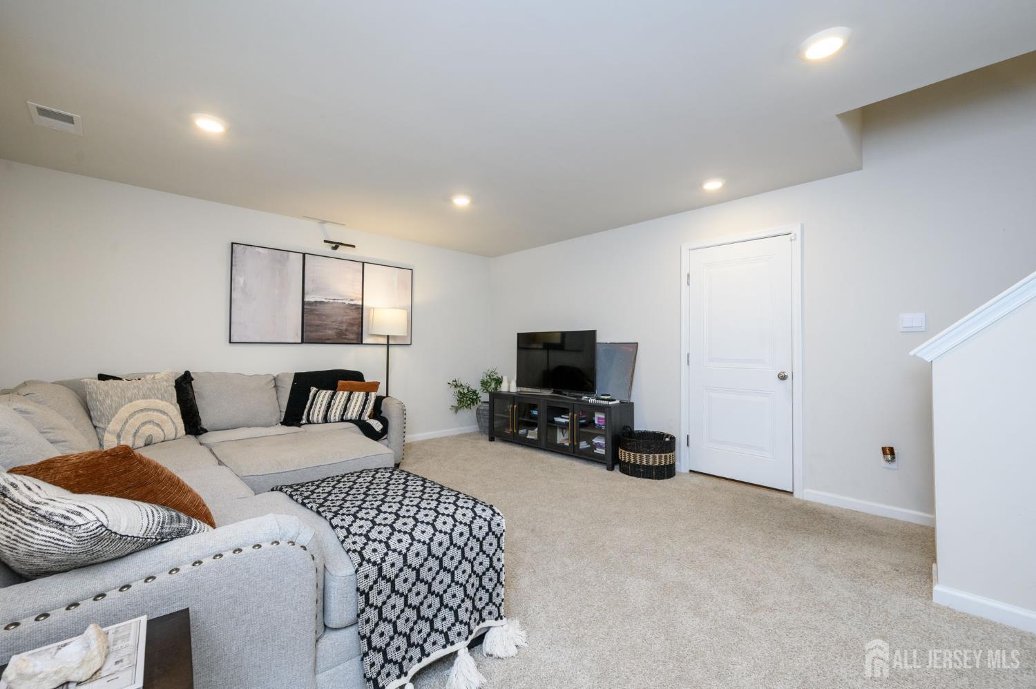 7 Foundry Blvd Mount Mount Holly, NJ 08060 - Photo 5 of 42 a bedroom with a bed a couch and a flat screen tv