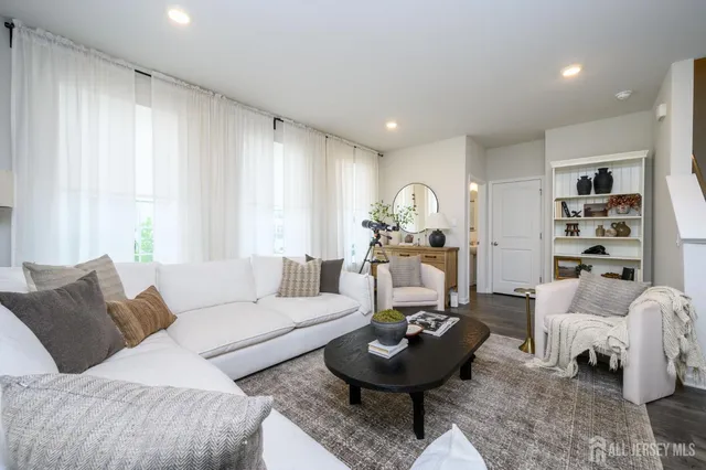 a living room with furniture and a table