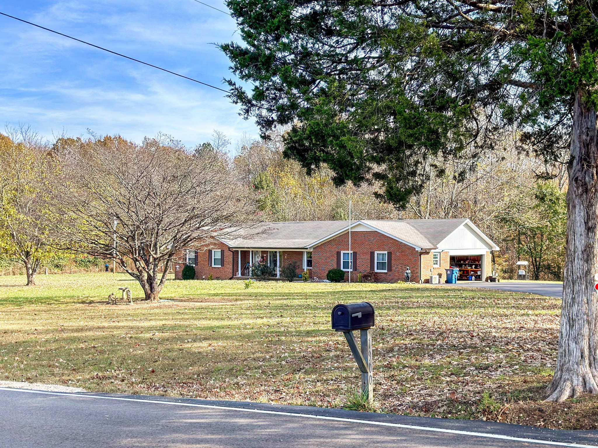 1900 Guthrie Road Paris, TN 38242 - Photo 1 of 36 a front view of a house with garden