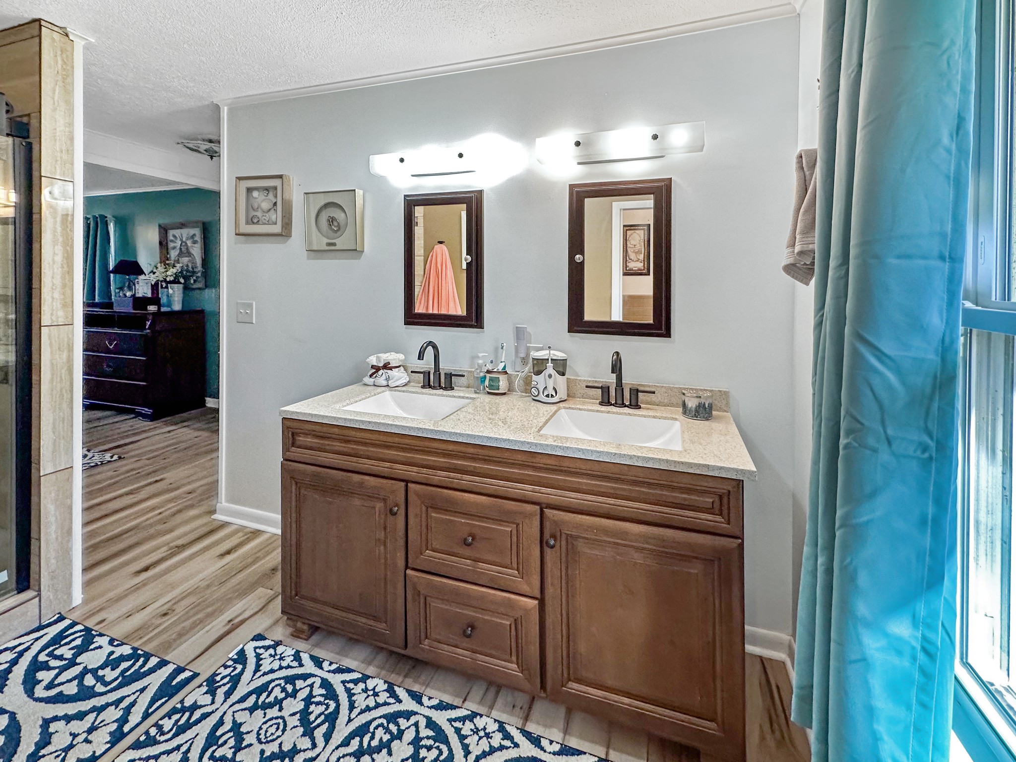 1900 Guthrie Road Paris, TN 38242 - Photo 13 of 36 a bathroom with a double vanity sink and a mirror