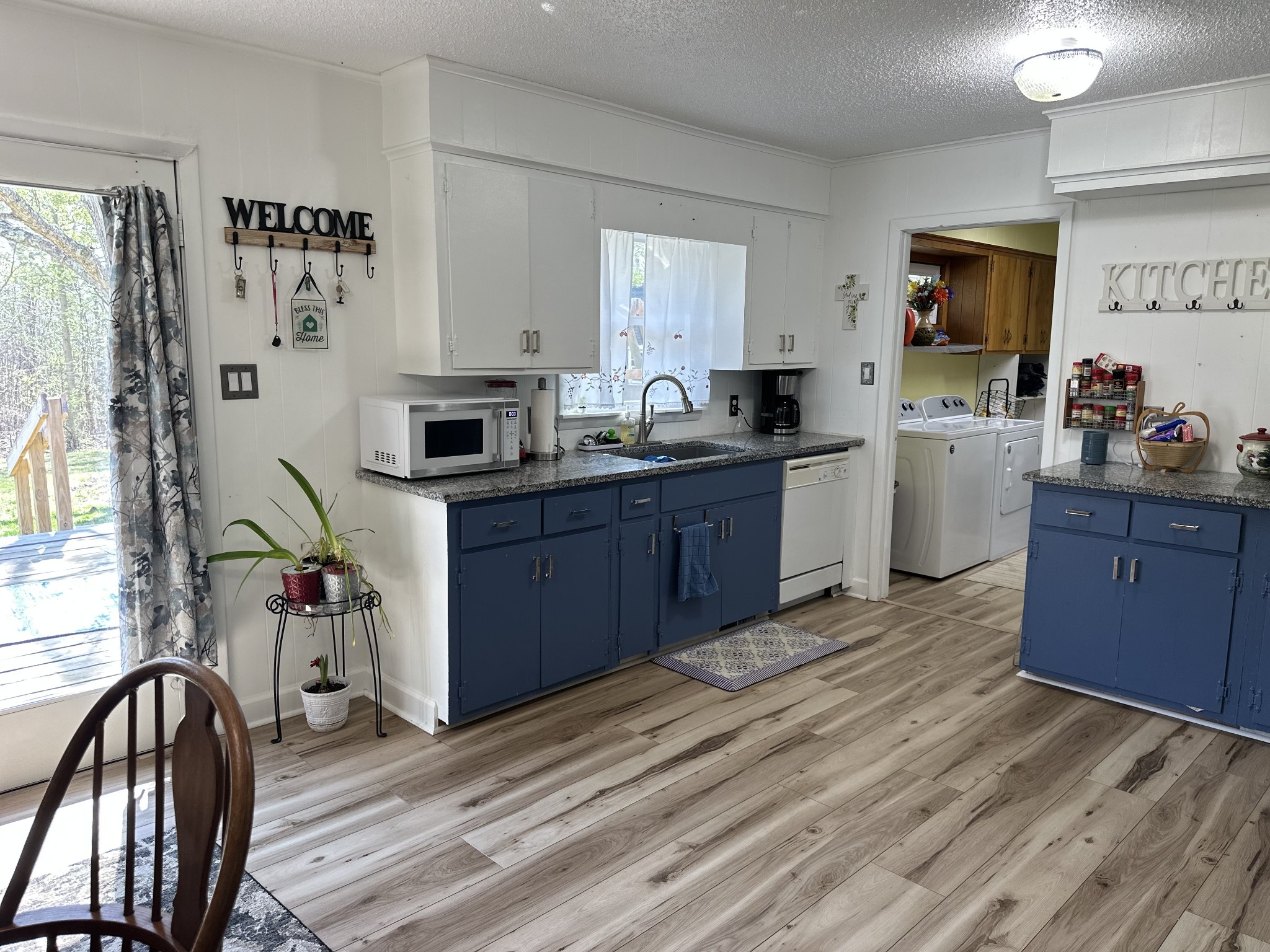 1900 Guthrie Road Paris, TN 38242 - Photo 17 of 36 a kitchen with cabinets a sink and appliances