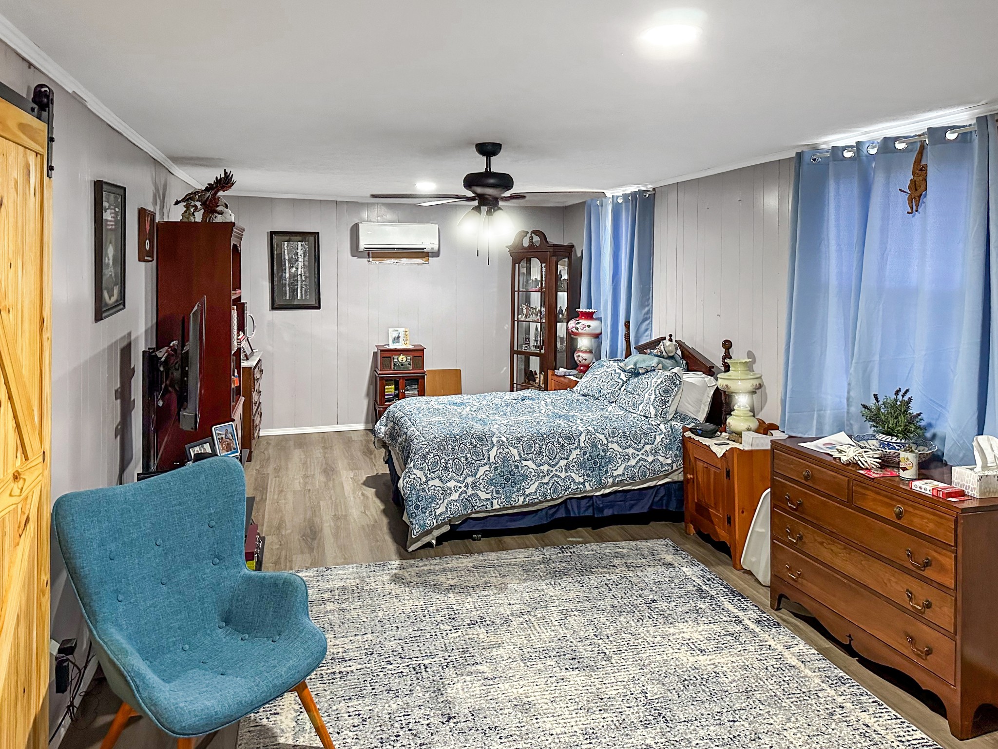 1900 Guthrie Road Paris, TN 38242 - Photo 21 of 36 a bedroom with a bed and wooden floor