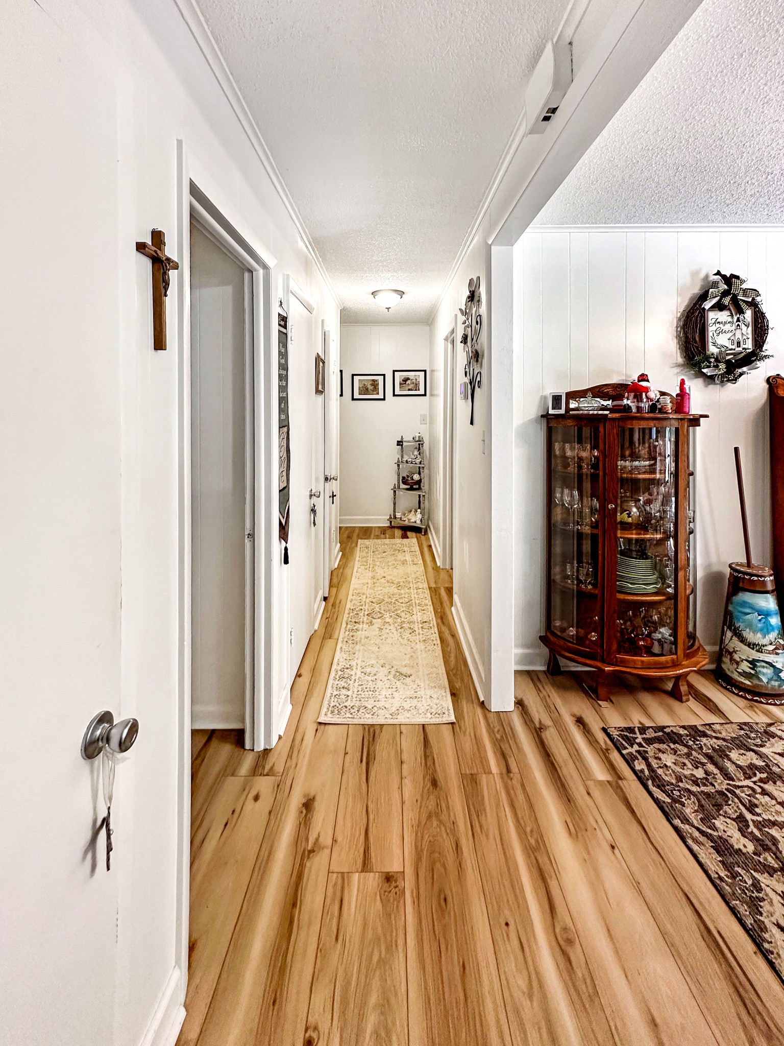 1900 Guthrie Road Paris, TN 38242 - Photo 6 of 36 a view of a hallway with a wooden floor