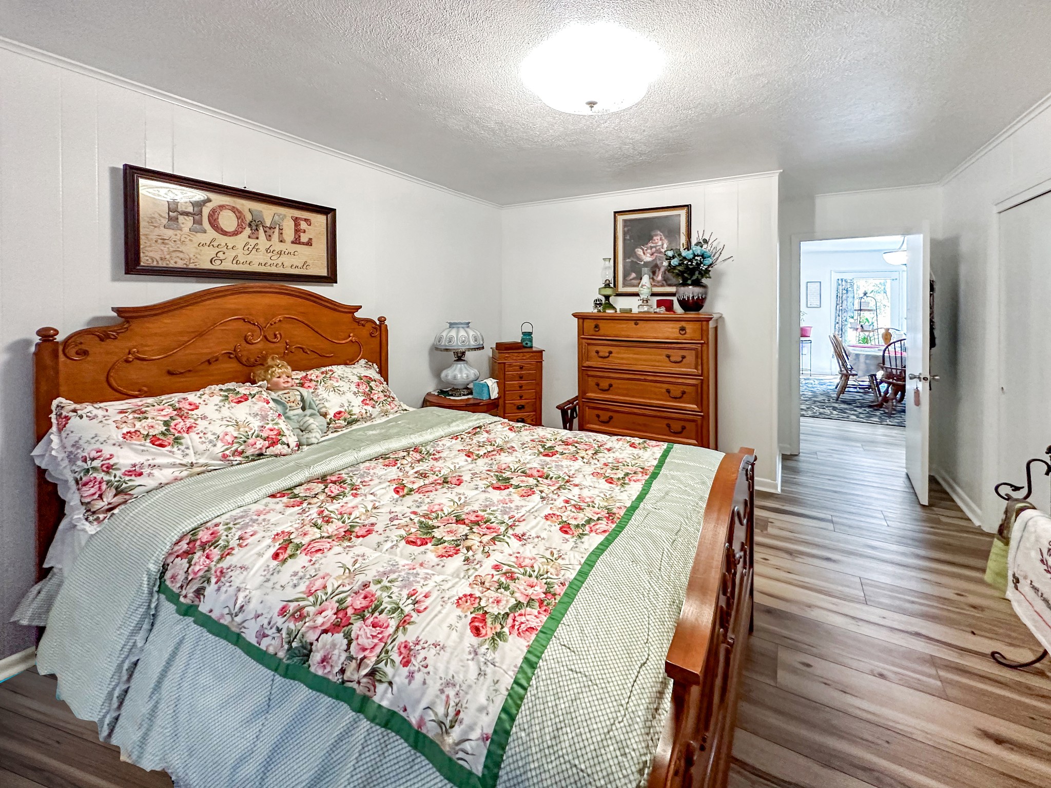 1900 Guthrie Road Paris, TN 38242 - Photo 8 of 36 a bed sitting in a bedroom and wooden floor