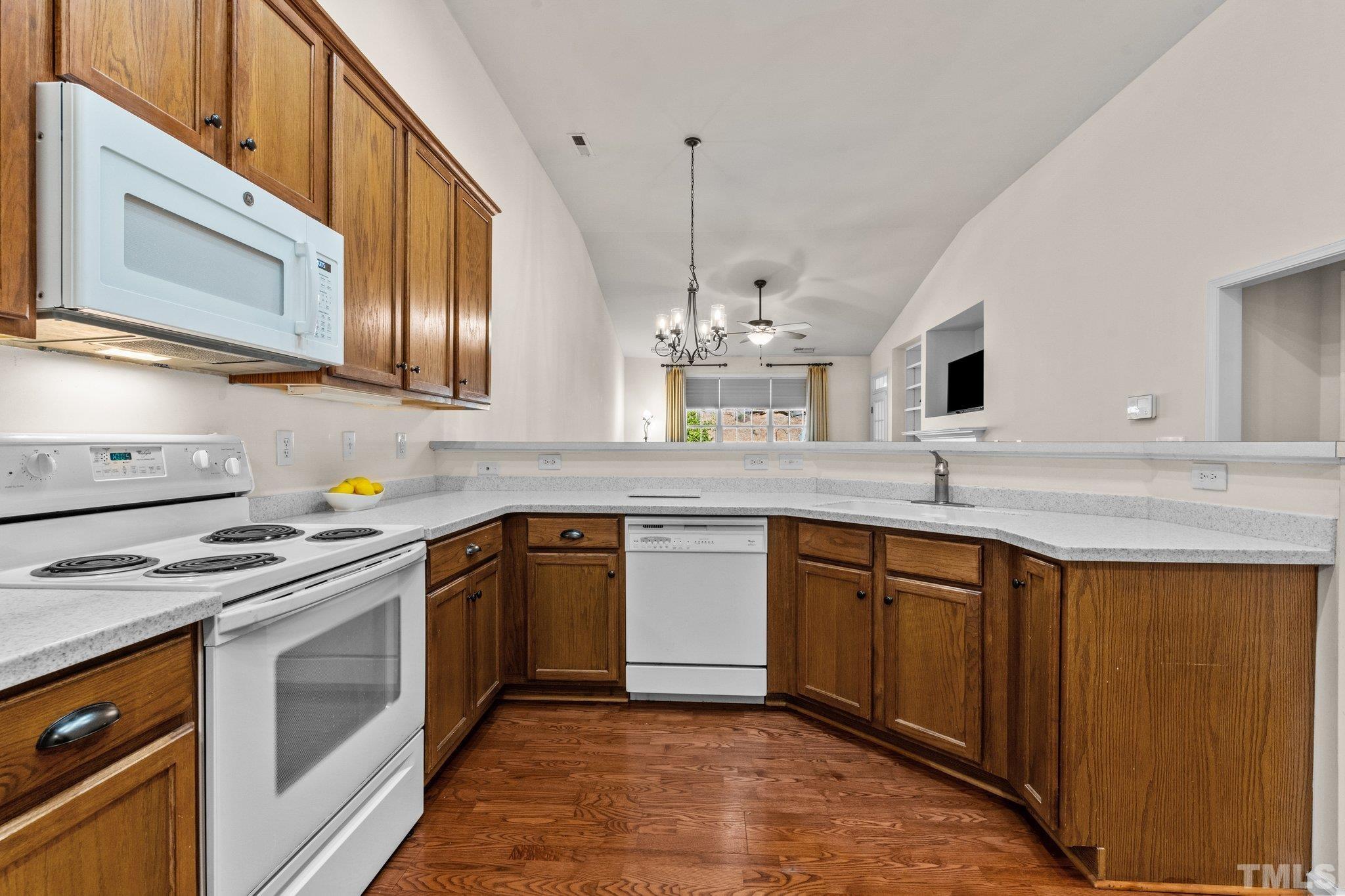 10507 Dapping Drive Raleigh, NC 27614 - Photo 12 of 38 a kitchen with stainless steel appliances granite countertop a sink stove and cabinets