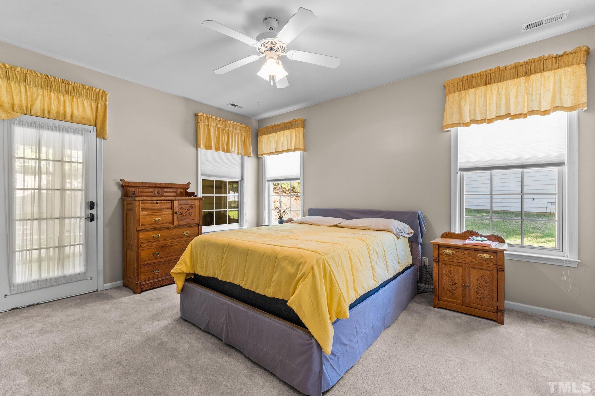 10507 Dapping Drive Raleigh, NC 27614 - Photo 16 of 38 a bed sitting in a spacious bedroom next to a window
