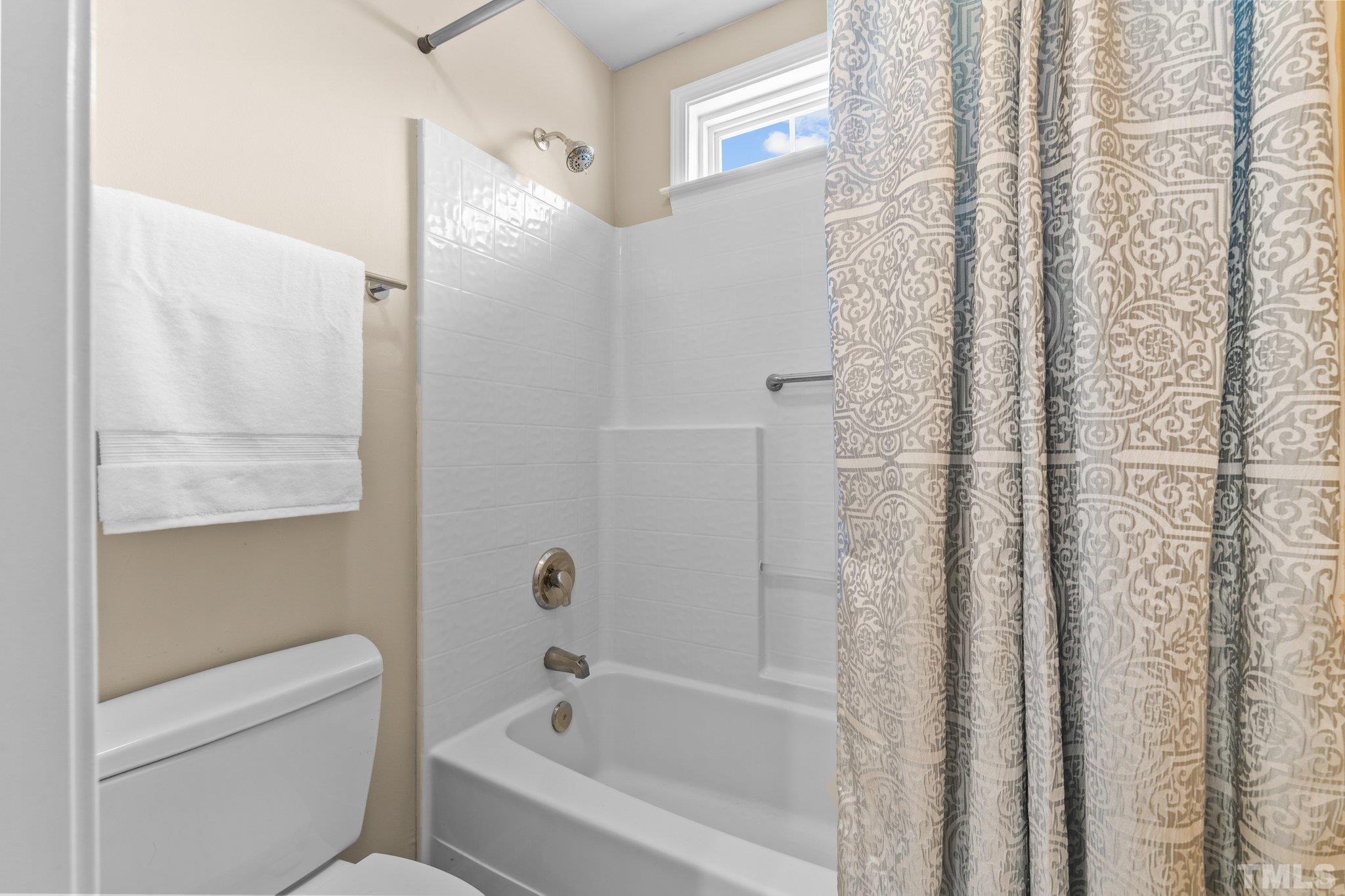 10507 Dapping Drive Raleigh, NC 27614 - Photo 29 of 38 a bathroom with bathtub and shower
