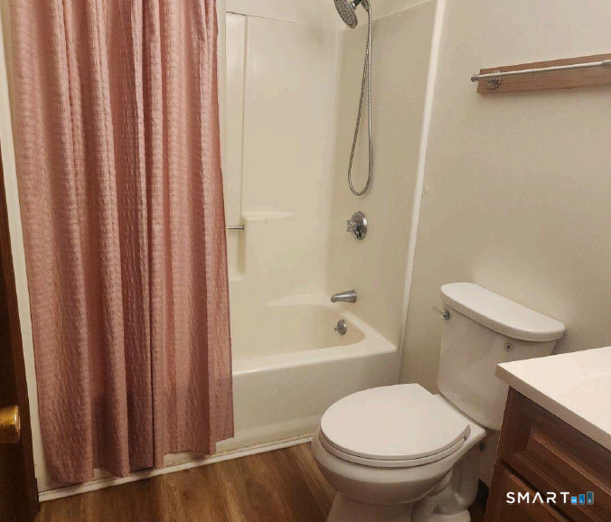 975 Meriden Road, Unit 101 Waterbury, CT 06705 - Photo 28 of 28 a bathroom with a toilet and a shower