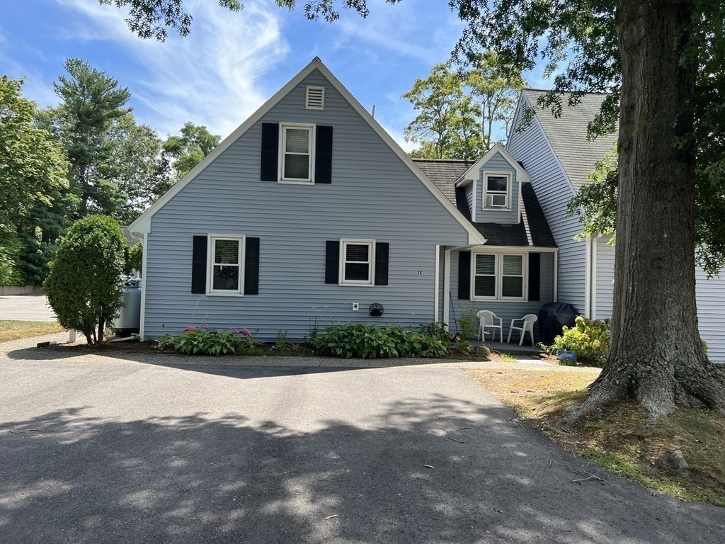 12 State Road, Unit 2E Plymouth, MA 02360 - Photo 22 of 28 a front view of a house with a yard