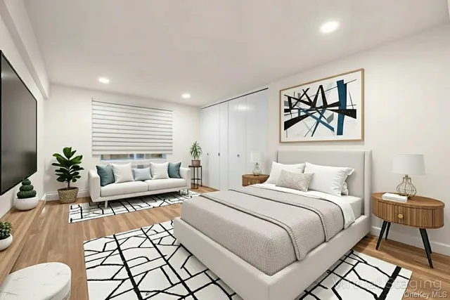 a spacious bedroom with a bed and a couch