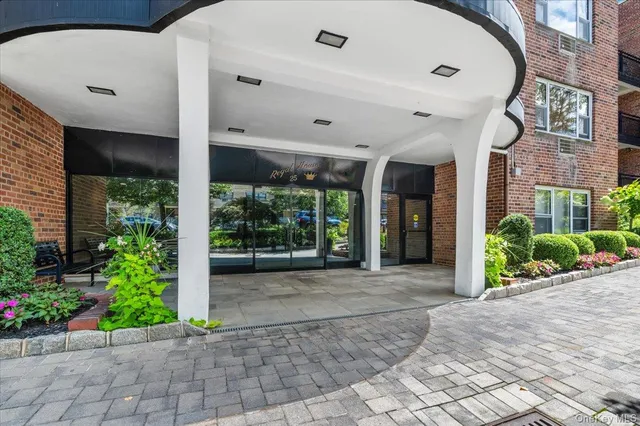 a front view of a building with garden