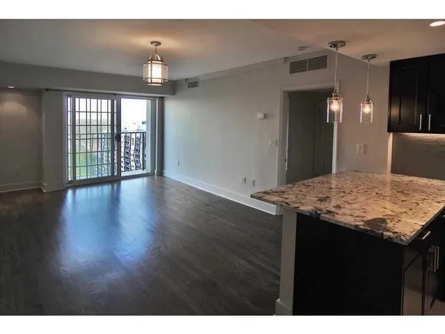 a view of a kitchen cabinets and wooden floor