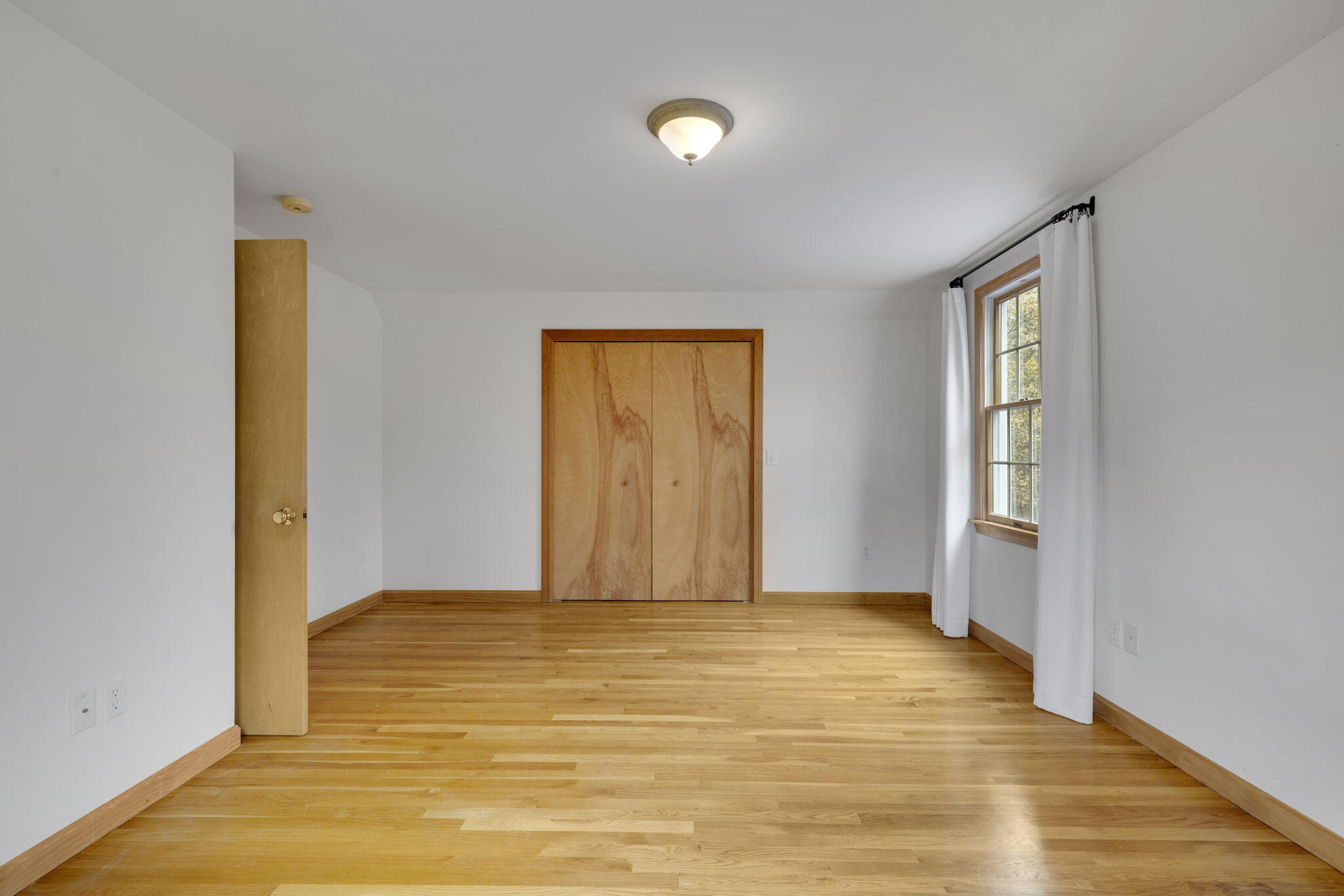 65 Whitney Road Eastham, MA 02642 - Photo 28 of 41 a view of an empty room with glass door
