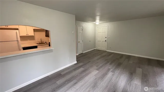 a bedroom with a bed and a lamp