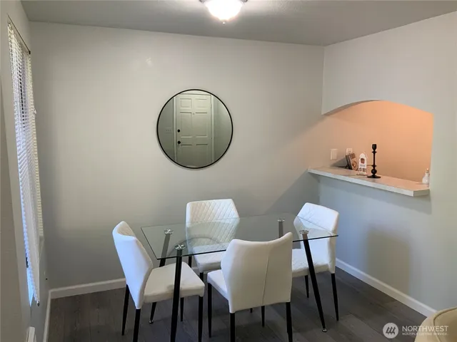 a kitchen with appliances a sink and cabinets
