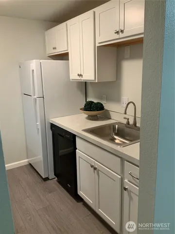 a kitchen with a stove and a microwave