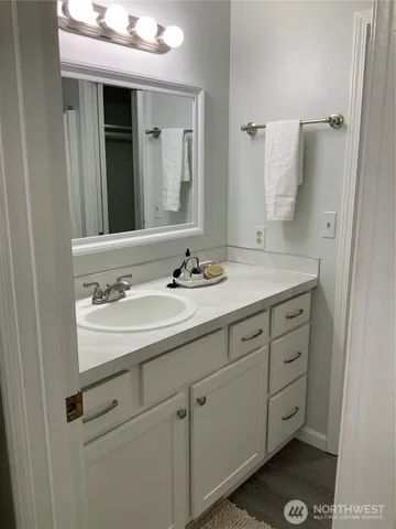 a bathroom with a shower and a tub