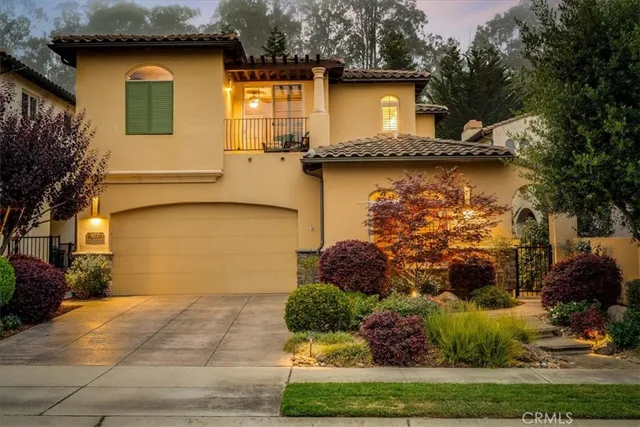 a view of a hallway with workspace and a window