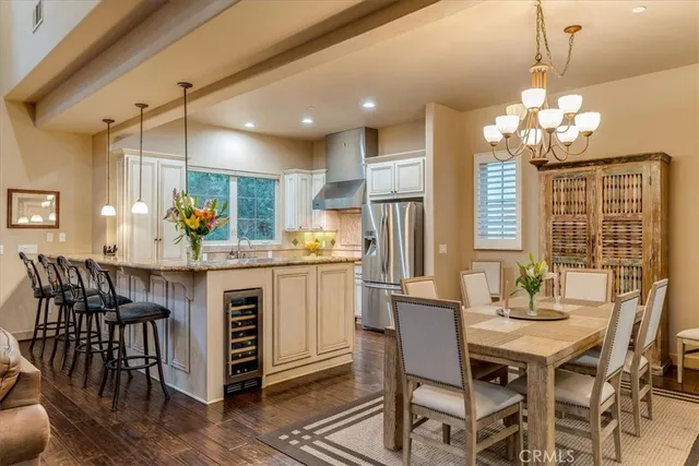 a kitchen with stainless steel appliances white cabinets and a granite counter tops