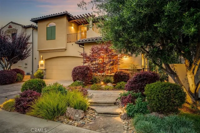 a living room with furniture a large window and a fireplace