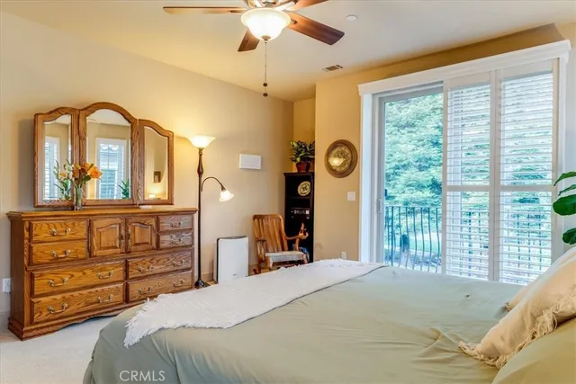 a bed room with a bed and a window