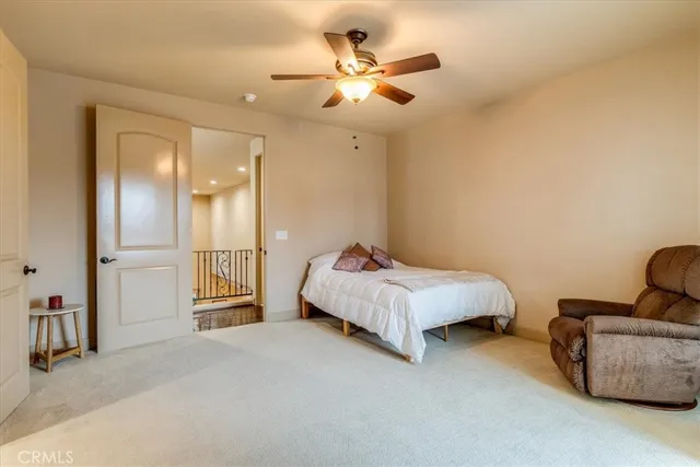 a view of a patio with a table and chairs under an umbrella