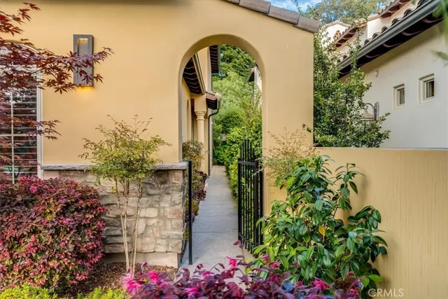 a living room with furniture a fireplace and a large window