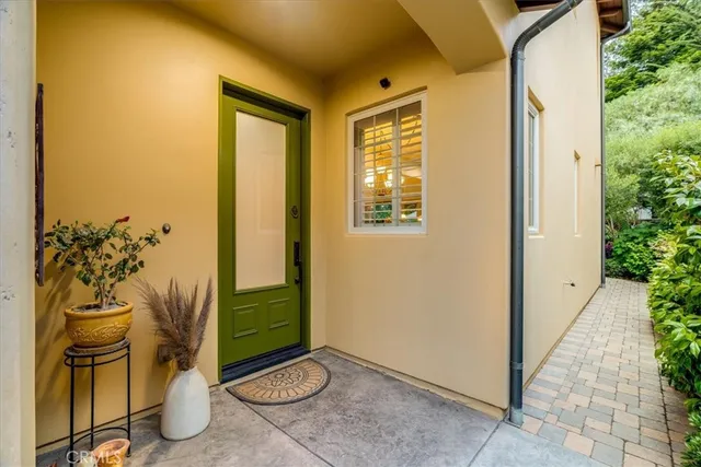 a living room with furniture fireplace and a large window