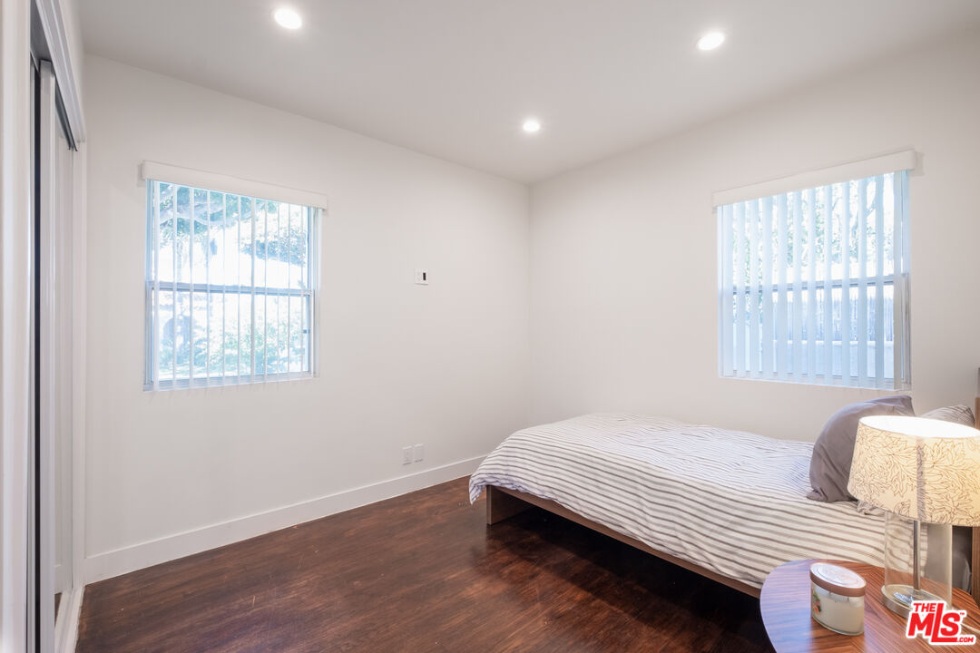 1024 Maple Street, Unit 1 Santa Monica, CA 90405 - Photo 13 of 16 a bedroom with a bed and wooden floor