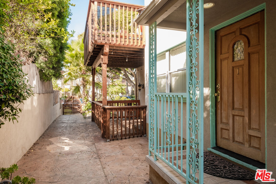 1024 Maple Street, Unit 1 Santa Monica, CA 90405 - Photo 16 of 16 a view of a porch with a table and chairs