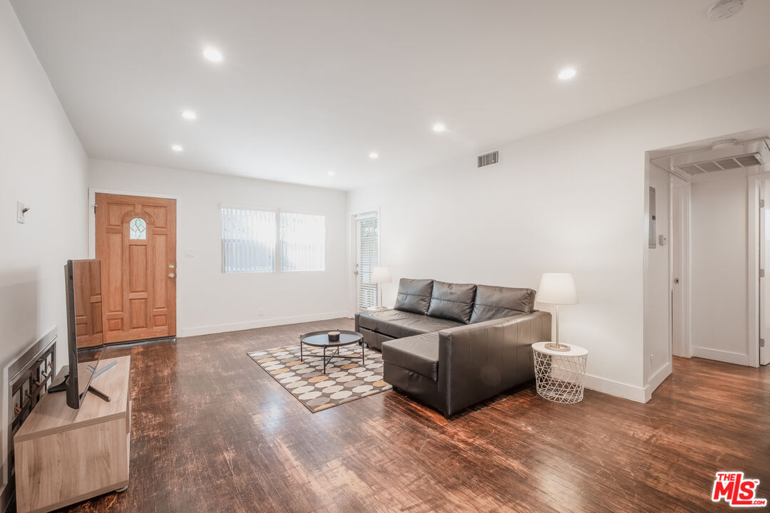 1024 Maple Street, Unit 1 Santa Monica, CA 90405 - Photo 2 of 16 a living room with furniture and a flat screen tv