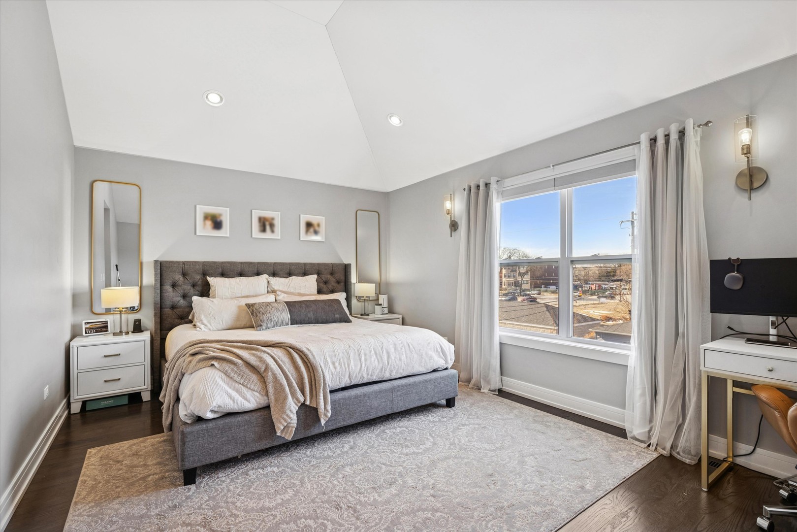4744 South Indiana Avenue Chicago, IL 60615 - Photo 15 of 27 a bedroom with a bed and a flat tv screen on the dresser