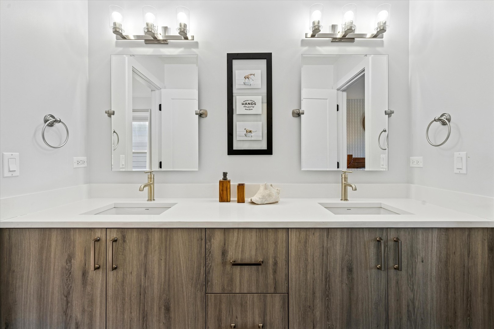 4744 South Indiana Avenue Chicago, IL 60615 - Photo 19 of 27 a bathroom with double vanity sinks and a mirror