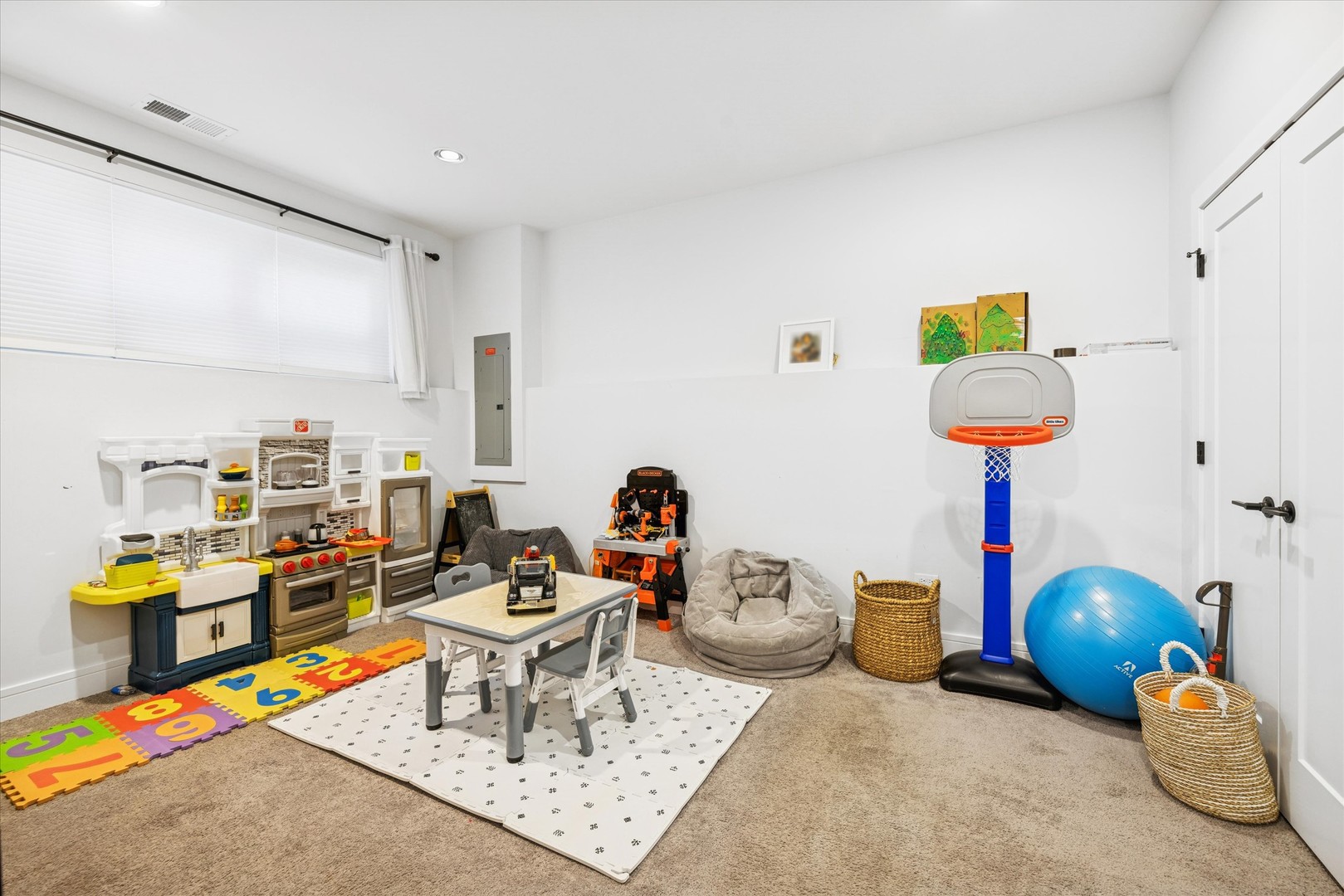 4744 South Indiana Avenue Chicago, IL 60615 - Photo 25 of 27 a living room with furniture and a table