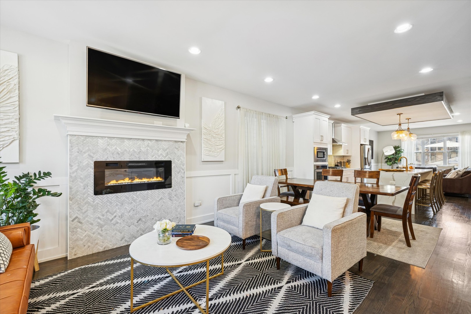 4744 South Indiana Avenue Chicago, IL 60615 - Photo 5 of 27 a living room with furniture a flat screen tv and a fireplace