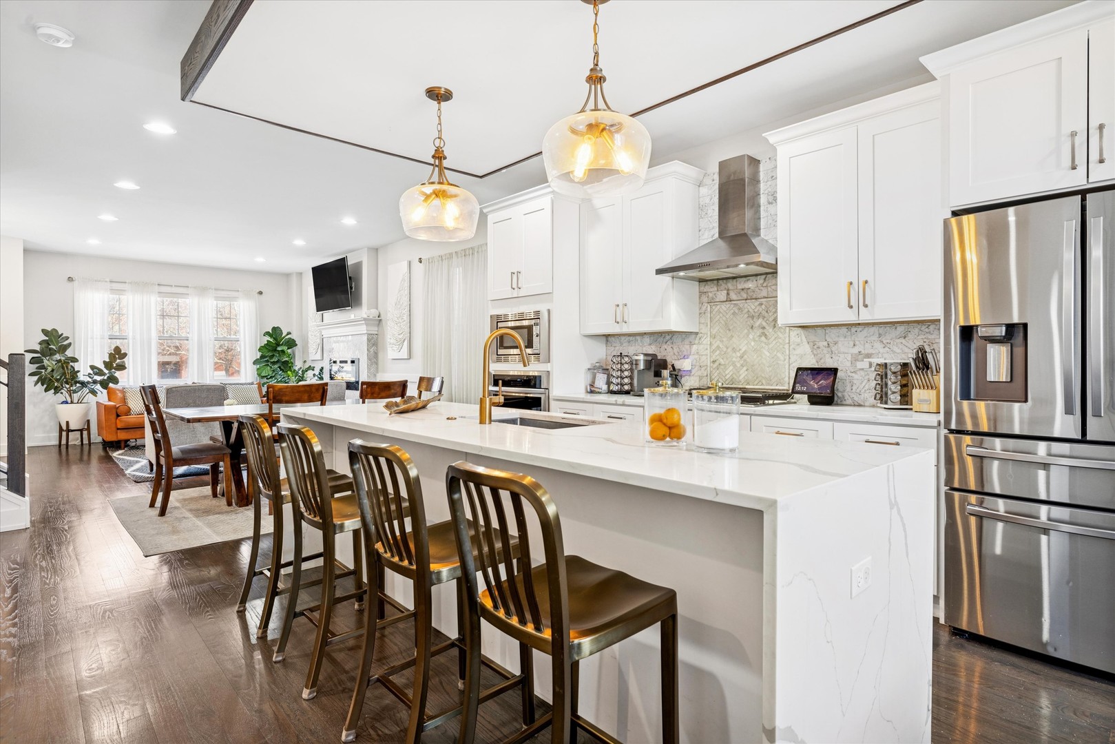 4744 South Indiana Avenue Chicago, IL 60615 - Photo 10 of 27 a kitchen with stainless steel appliances a white refrigerator a stove a dining table and chairs