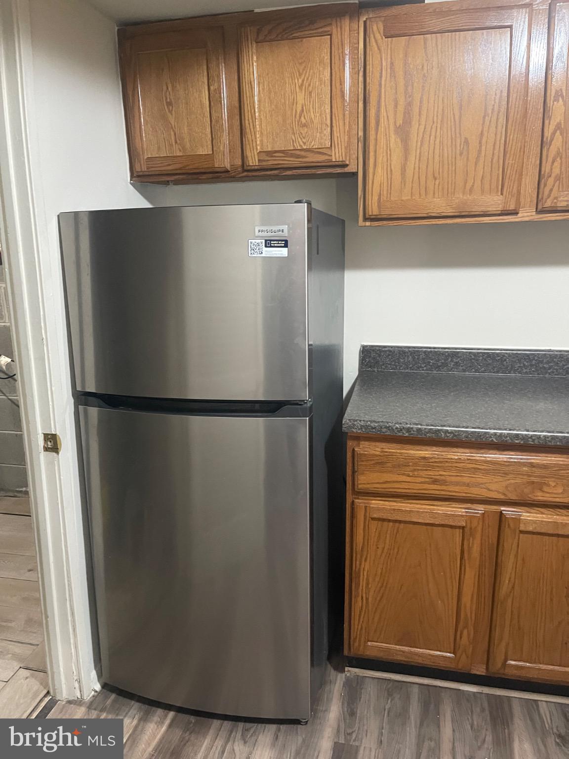 2360 Sun Valley Circle, Unit 2GH Silver Spring, MD 20906 - Photo 17 of 28 Modern kitchen with stainless fridge