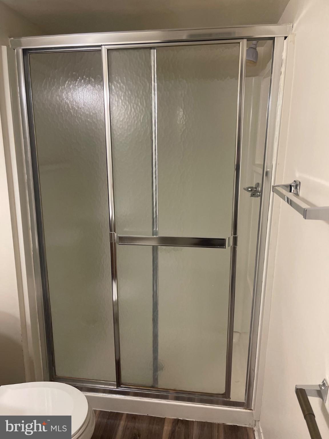 2360 Sun Valley Circle, Unit 2GH Silver Spring, MD 20906 - Photo 9 of 28 Modern shower enclosure with sleek design.