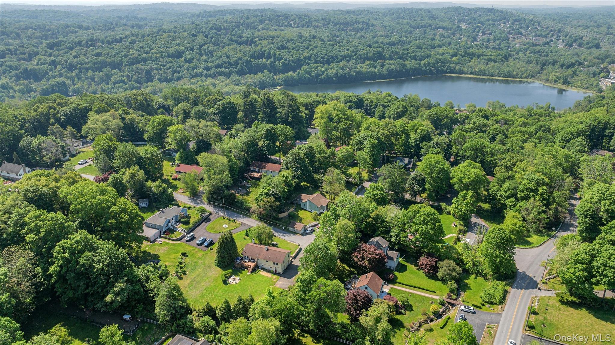 340 Osceola Road Jefferson Valley, NY 10535 - Photo 42 of 48 an aerial view of residential house with outdoor space and trees around