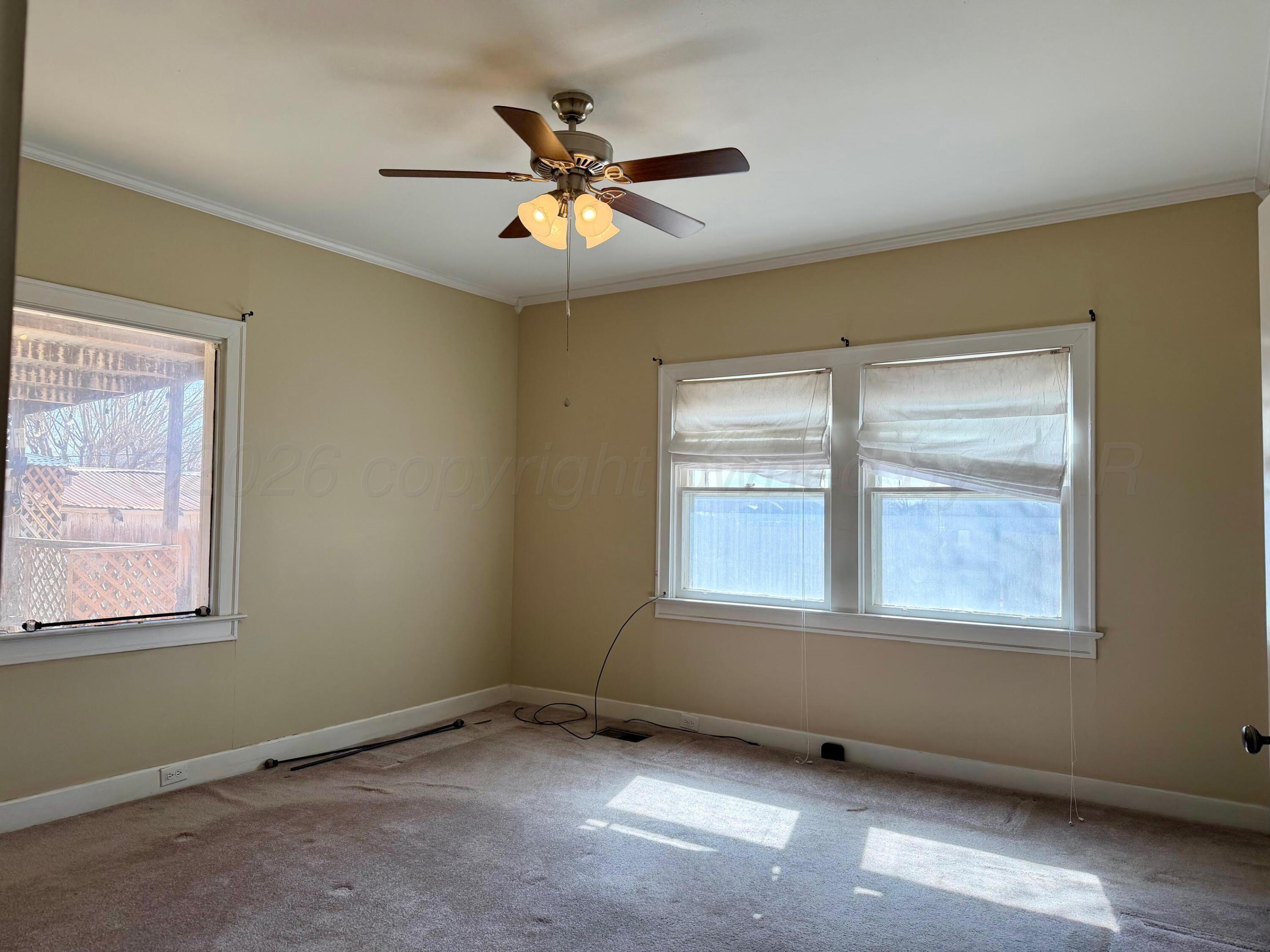 920 Montgomery Street Memphis, TX 79245 - Photo 11 of 30 a view of an empty room with a window