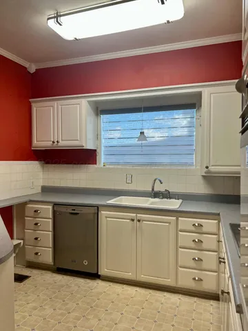 a kitchen with stainless steel appliances granite countertop a stove and a sink