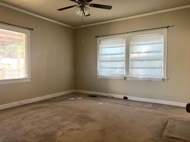 a view of an empty room with a window