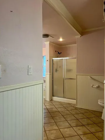 a bathroom with a shower and a sink