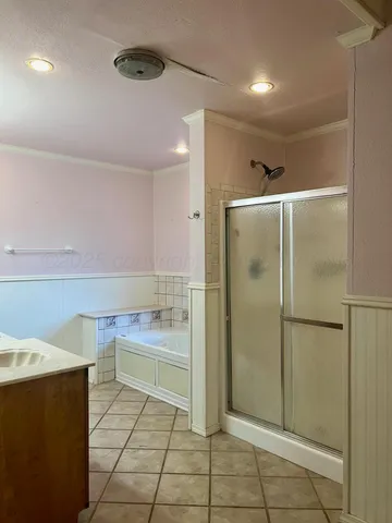 a bathroom with a bathtub and a shower