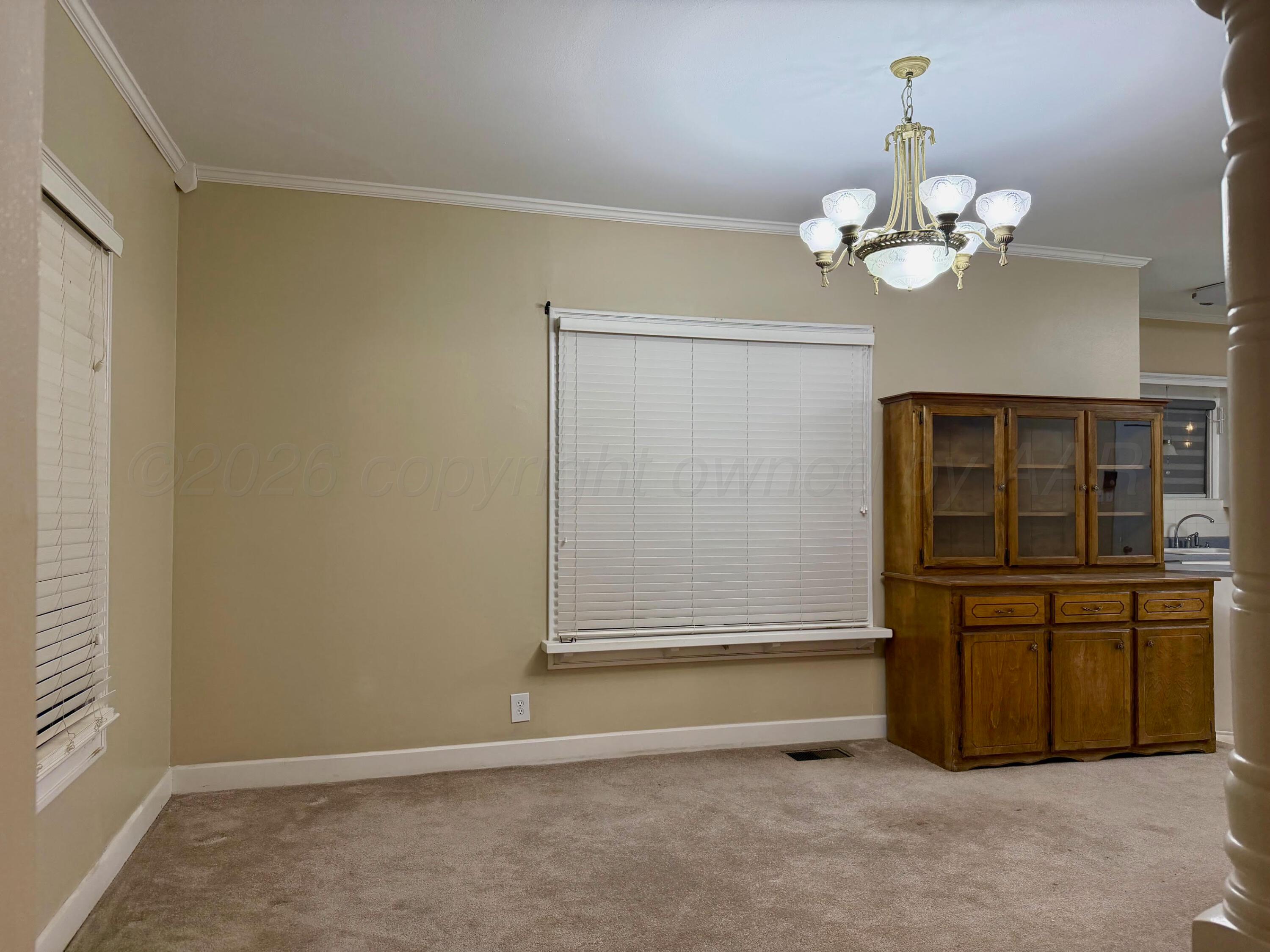 920 Montgomery Street Memphis, TX 79245 - Photo 6 of 30 a view of an empty room with a window