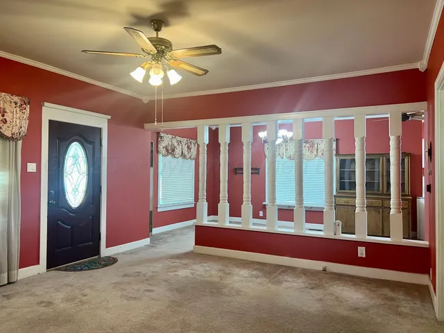 a view of an empty room with a window