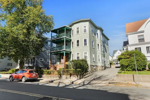 a view of a street with cars