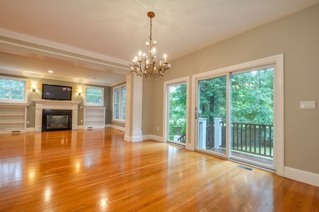 50 Tanglewood Road Newton, MA 02459 - Photo 12 of 42 a view of an empty room with wooden floor and a window