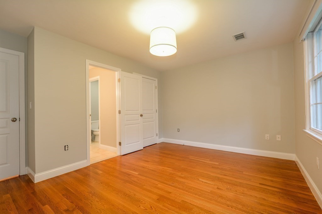 50 Tanglewood Road Newton, MA 02459 - Photo 23 of 42 a view of empty room with wooden floor