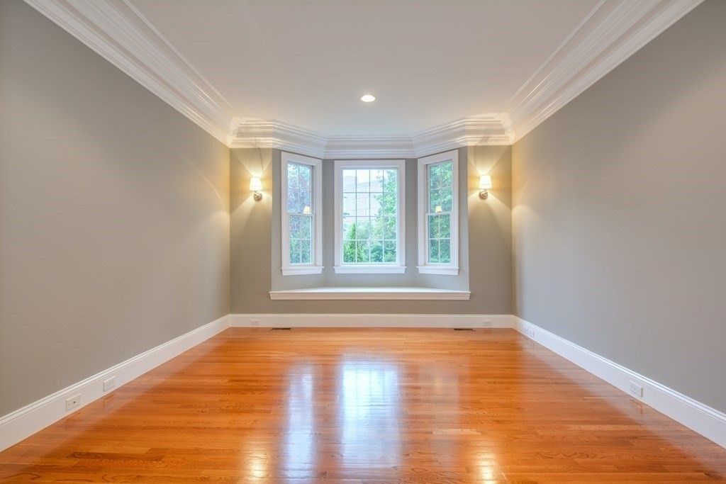 50 Tanglewood Road Newton, MA 02459 - Photo 4 of 42 a view of empty room with wooden floor and fan
